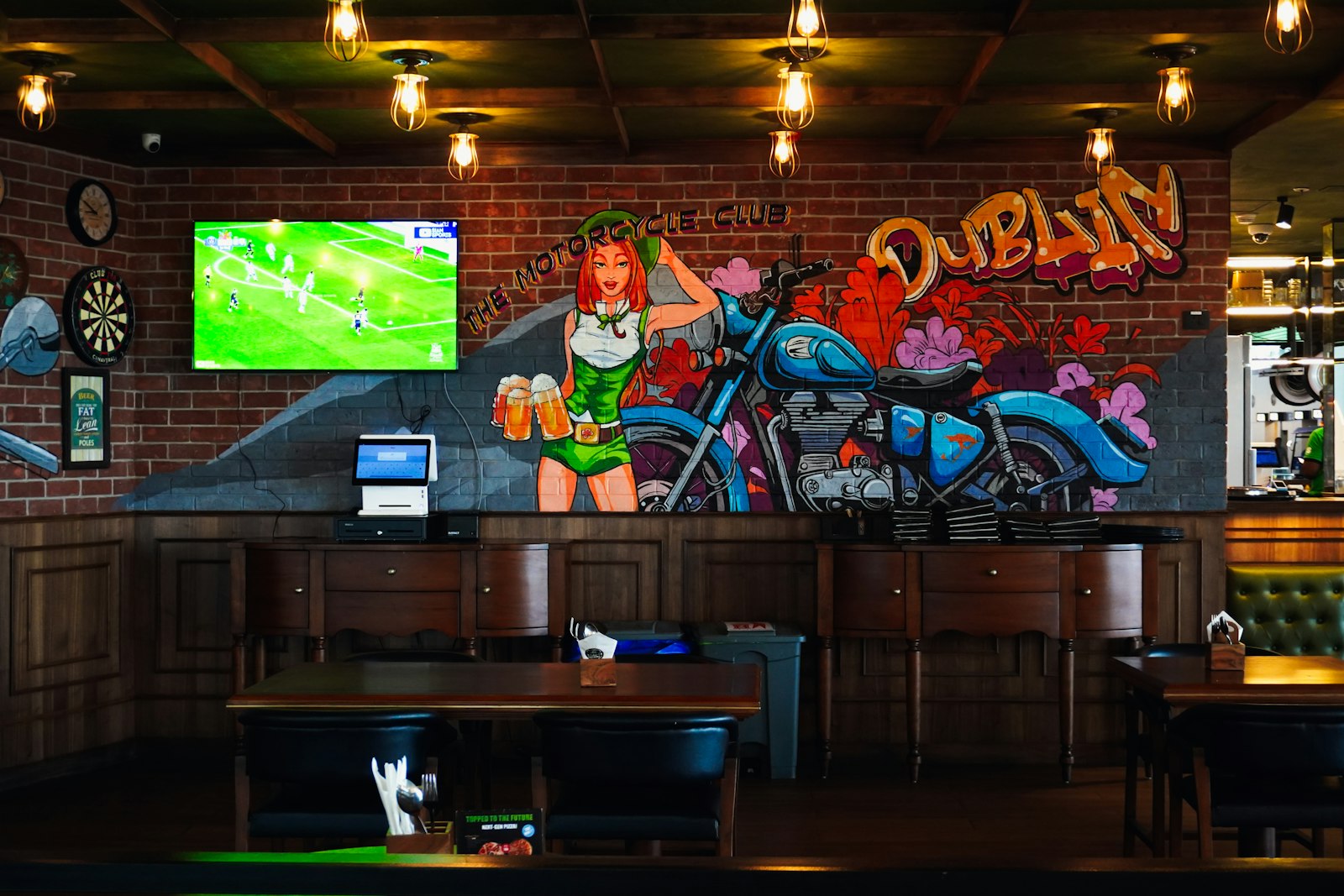 The Flying Bear sports bar interior with televisions and warm lighting