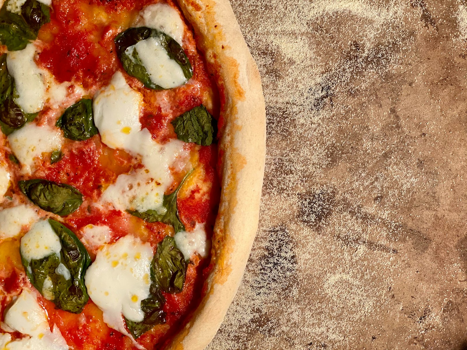 Classic margherita pizza with fresh buffalo mozzarella, tomato sauce, and basil